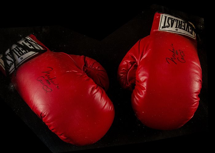 Muhammed Ali, a pair of boxing gloves